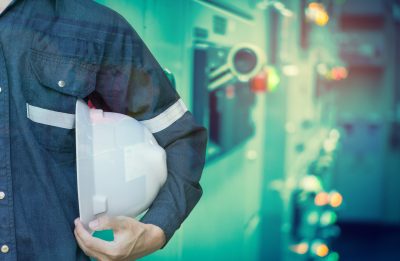 Double exposure of Engineer or Technician man holding safety hat with electrical switchgear room for electricity industrial business concept