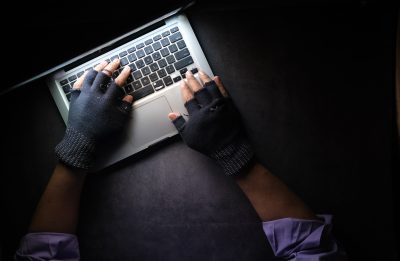 Image of an individual at a computer.